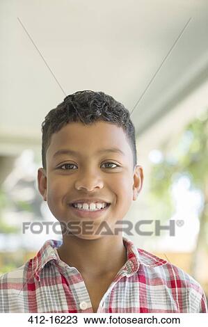 Close up portrait of smiling boy View Large Photo Image Stock Image - Close up portrait of smiling boy. Fotosearch