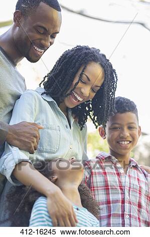 Stock Photography - Happy family outdoors. Fotosearch