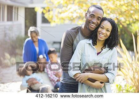 Portrait of happy couple hugging outdoors View Large Photo Image Stock Image - Portrait of happy couple hugging outdoors. Fotosearch
