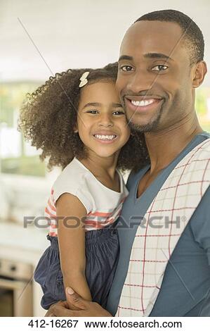 Portrait of smiling father and daughter View Large Photo Image Stock Photo - Portrait of smiling father and daughter. Fotosearch