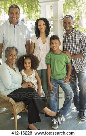 Stock Photo - Portrait of smiling multi-generation family outdoors. Fotosearch