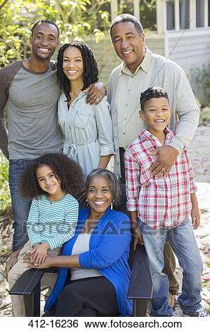 Portrait of smiling multi-generation family outdoors View Large Photo Image Stock Photograph - Portrait of smiling multi-generation family outdoors. Fotosearch