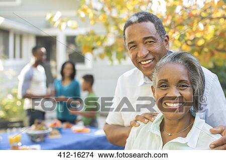 Portrait of smiling senior couple at barbecue View Large Photo Image Picture - Portrait of smiling senior couple at barbecue. Fotosearch
