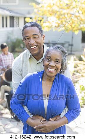 Portrait of smiling senior couple outdoors View Large Photo Image Stock Image - Portrait of smiling senior couple outdoors. Fotosearch