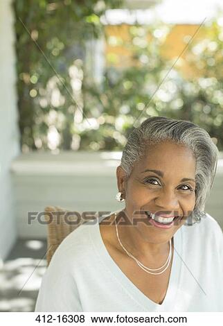Portrait of smiling senior woman on porch View Large Photo Image Stock Photo - Portrait of smiling senior woman on porch. Fotosearch