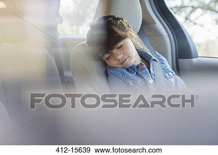 Girl sleeping in back seat of car View Large Photo Image Stock Photo - Girl sleeping in back seat of car. Fotosearch