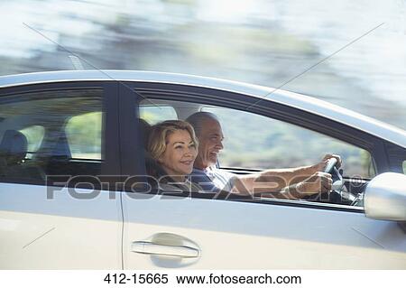 Happy senior couple driving in car View Large Photo Image Stock Photography - Happy senior couple driving in car. Fotosearch