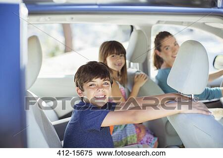 Portrait of happy family inside of car View Large Photo Image Stock Photography - Portrait of happy family inside of car. Fotosearch
