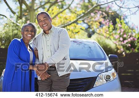 Portrait of happy senior couple leaning on car View Large Photo Image Picture - Portrait of happy senior couple leaning on car. Fotosearch