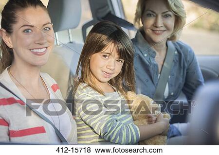 Portrait of multi-generation women inside car View Large Photo Image Stock Photo - Portrait of multi-generation women inside car. Fotosearch