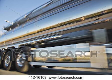 Stock Photo - Blurred view of stainless steel milk tanker on the move. Fotosearch