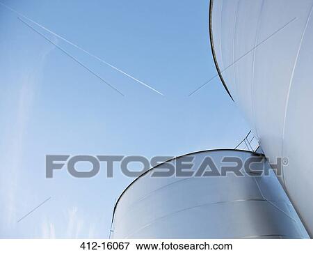 Silage storage towers against blue sky View Large Photo Image Stock Photo - Silage storage towers against blue sky. Fotosearch