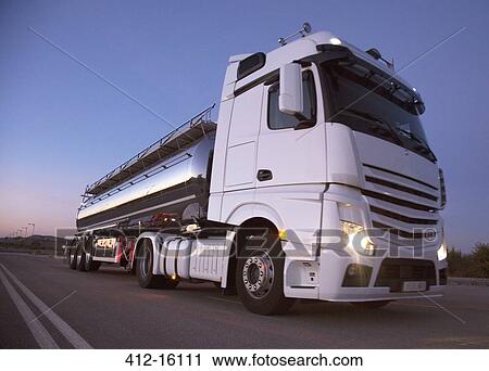 Stainless steel milk tanker on the road at night View Large Photo Image Stock Image - Stainless steel milk tanker on the road at night. Fotosearch