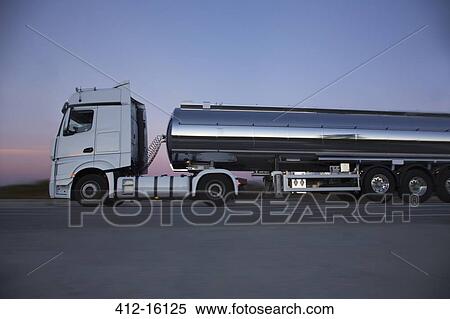 Stainless steel milk tanker on the road at night View Large Photo Image Stock Photography - Stainless steel milk tanker on the road at night. Fotosearch