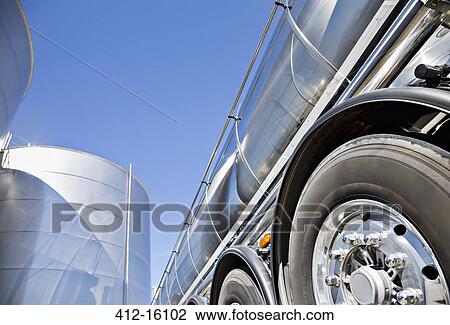 Stainless steel milk tanker parked next to silage storage tower View Large Photo Image Stock Image - Stainless steel milk tanker parked next to silage storage tower. Fotosearch
