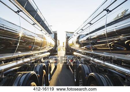 Stock Photo - Stainless steel milk tankers side by side. Fotosearch