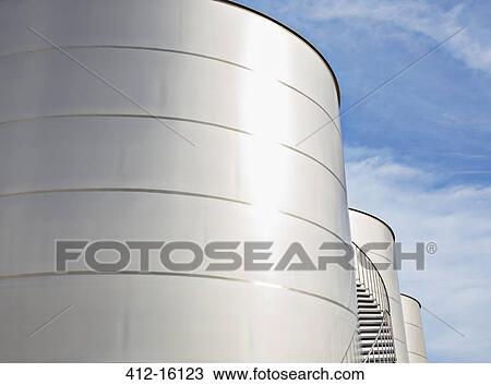 Sun reflecting on silage storage towers View Large Photo Image Stock Image - Sun reflecting on silage storage towers. Fotosearch