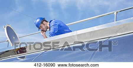 Worker on platform above stainless steel milk tanker View Large Photo Image Stock Image - Worker on platform above stainless steel milk tanker. Fotosearch