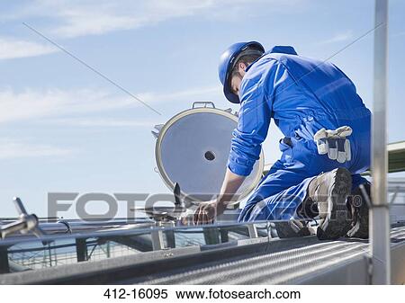 Worker on platform looking down at milk tanker View Large Photo Image Stock Photography - Worker on platform looking down at milk tanker. Fotosearch