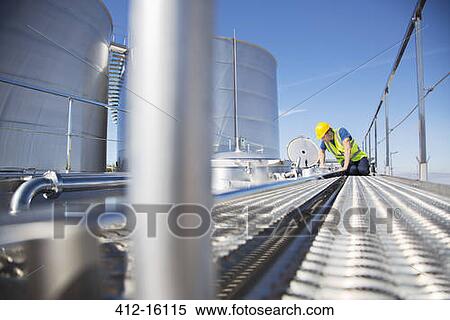 Worker on platform looking down into milk tanker View Large Photo Image Stock Photography - Worker on platform looking down into milk tanker. Fotosearch