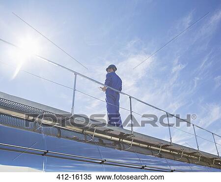 Worker on platform View Large Photo Image Stock Photography - Worker on platform. Fotosearch