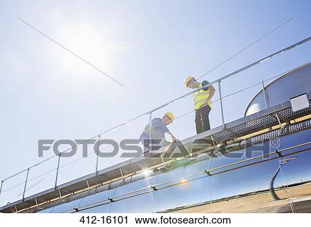 Workers on platform above stainless steel milk tanker View Large Photo Image Stock Image - Workers on platform above stainless steel milk tanker. Fotosearch