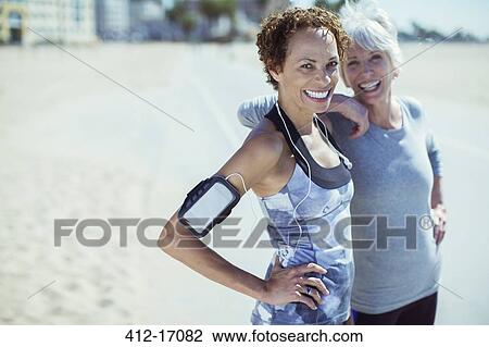 Portrait of smiling women in sportswear outdoors View Large Photo Image Stock Image - Portrait of smiling women in sportswear outdoors. Fotosearch