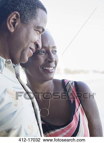 Stock Image - Senior couple hugging. Fotosearch