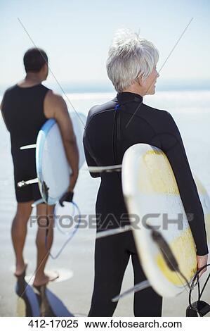 Senior couple with surfboards on beach View Large Photo Image Stock Photography - Senior couple with surfboards on beach. Fotosearch