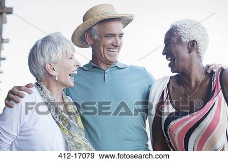 Stock Photo - Senior friends laughing. Fotosearch