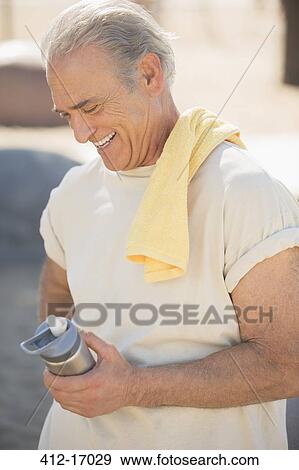 Senior man with water bottle View Large Photo Image Stock Photo - Senior man with water bottle. Fotosearch