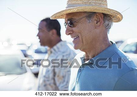 Senior men in sunny parking lot View Large Photo Image Stock Image - Senior men in sunny parking lot. Fotosearch