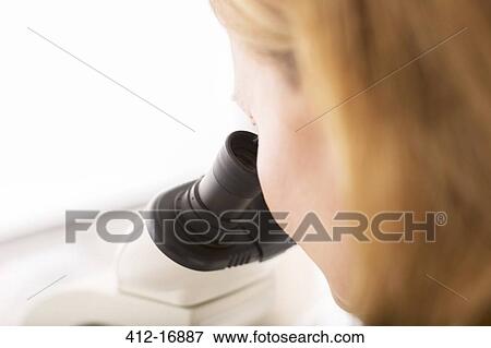 Close up of scientist using microscope in laboratory View Large Photo Image Stock Photo - Close up of scientist using microscope in laboratory. Fotosearch