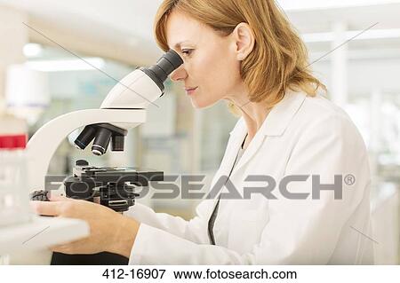 Scientist using microscope in laboratory View Large Photo Image Stock Photo - Scientist using microscope in laboratory. Fotosearch