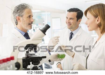 Stock Photo - Scientists working in laboratory. Fotosearch