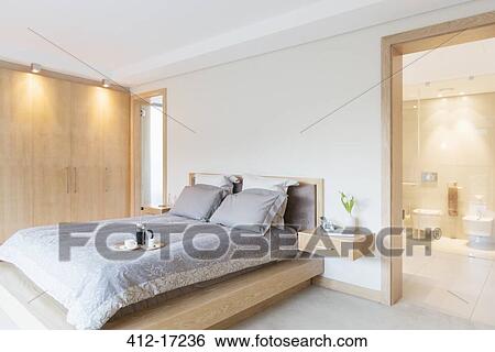 Stock Photograph - Luxury bedroom and ensuite bathroom. Fotosearch