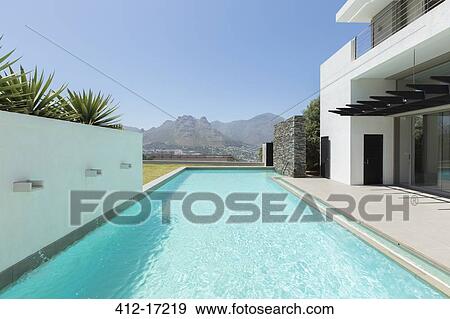 Luxury lap pool overlooking mountains View Large Photo Image Stock Photo - Luxury lap pool overlooking mountains. Fotosearch