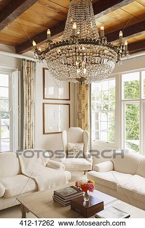 Stock Image - Luxury living room with chandelier. Fotosearch