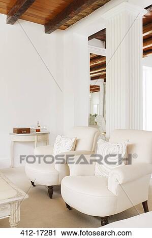 Stock Image - Luxury living room with pillar. Fotosearch
