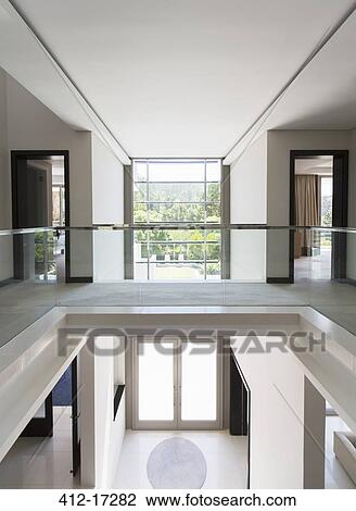 Modern Balcony And Open Foyer In Luxury Home Stock Image