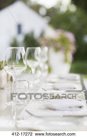 Place settings on patio table View Large Photo Image Stock Image - Place settings on patio table. Fotosearch