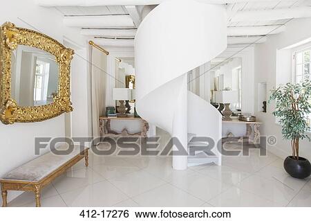 Stock Photograph - Spiral staircase in luxury foyer. Fotosearch