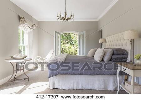 Stock Photo - Sunny luxury bedroom. Fotosearch