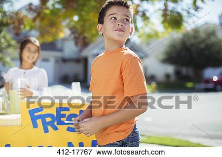 Boy buying lemonade at lemonade stand View Large Photo Image Stock Photo - Boy buying lemonade at lemonade stand. Fotosearch