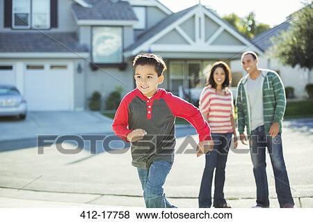 Stock Photo - Boy running outdoors. Fotosearch