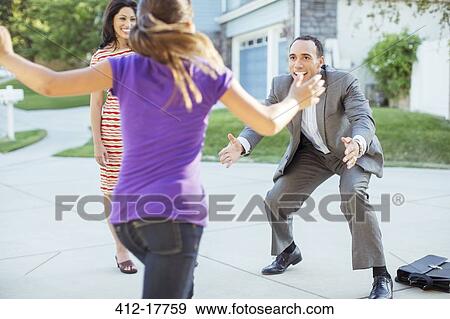 Stock Photo - Daughter running to father in driveway. Fotosearch