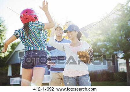 Family playing baseball View Large Photo Image Stock Image - Family playing baseball. Fotosearch