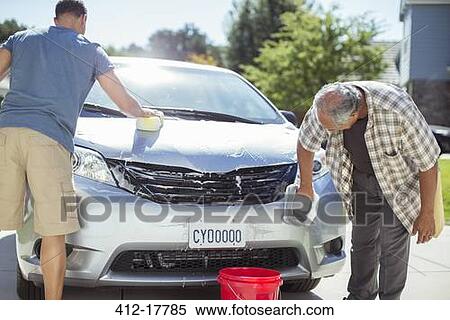 Father and son washing car in driveway View Large Photo Image Stock Photography - Father and son washing car in driveway. Fotosearch