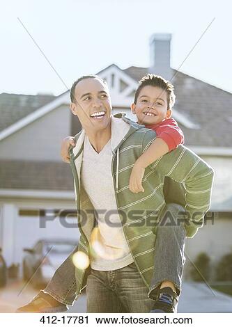 Father piggybacking son View Large Photo Image Stock Image - Father piggybacking son. Fotosearch