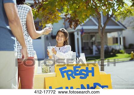Girl selling lemonade at lemonade stand View Large Photo Image Stock Image - Girl selling lemonade at lemonade stand. Fotosearch